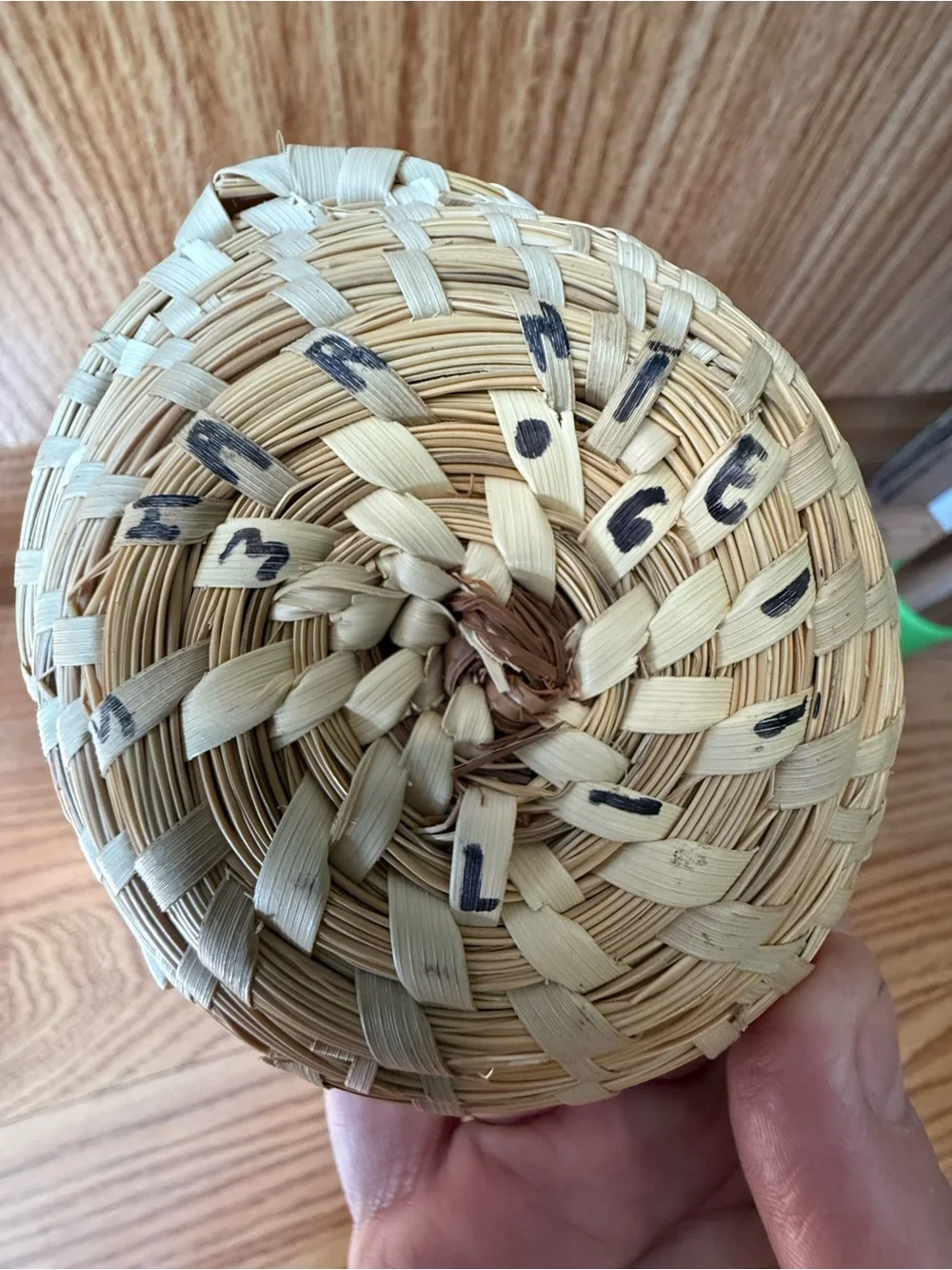 Atraditional hand-woven sweetgrass basket